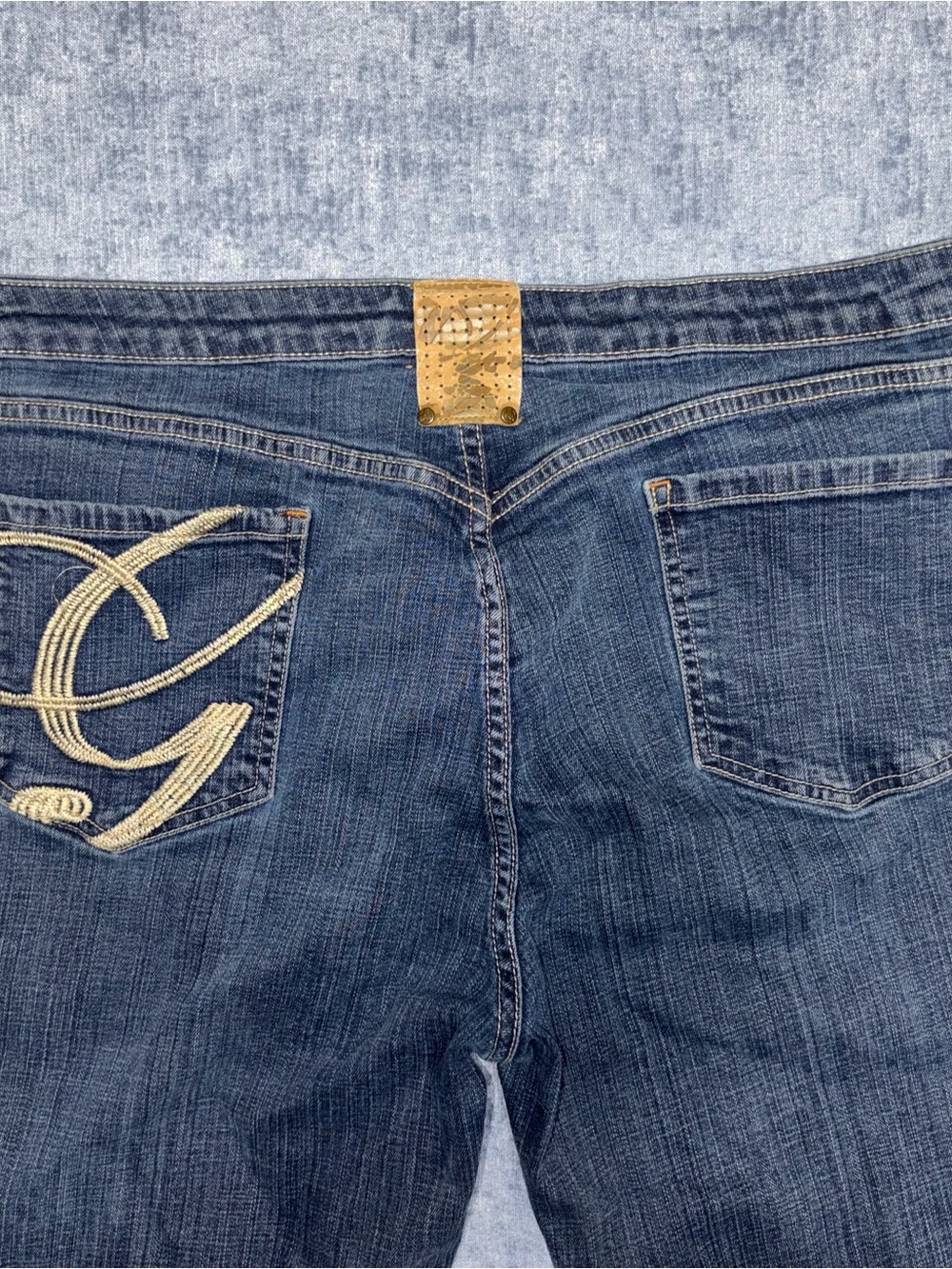 Y2K G Unit low rise bootcut jeans with gold embroidered logo on back pocket
